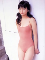 Adorably sweet asian beauty is terribly cute in a pink swim suit