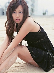 Jun Natsukawa Asian cutie posing at the beach in her minidress